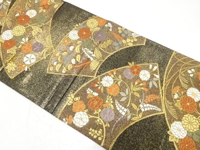 Bag belt with a design of autumn grasses woven into the ground paper
